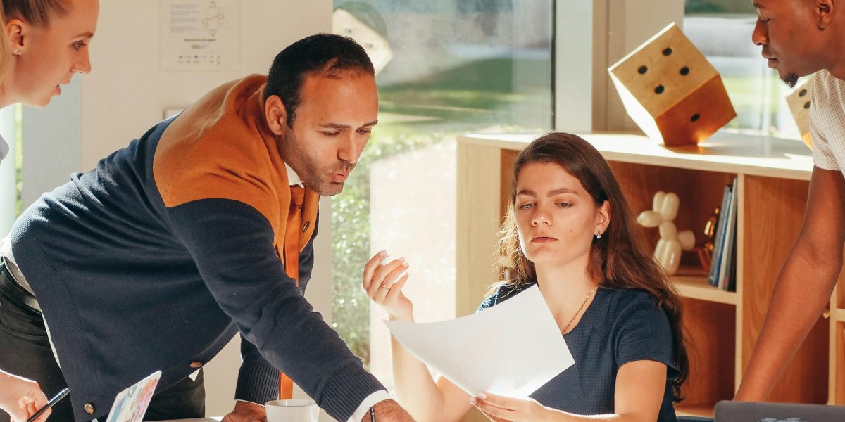 A team collaborating in a modern office, representing the future trends of PropTech and digital strategies in real estate.