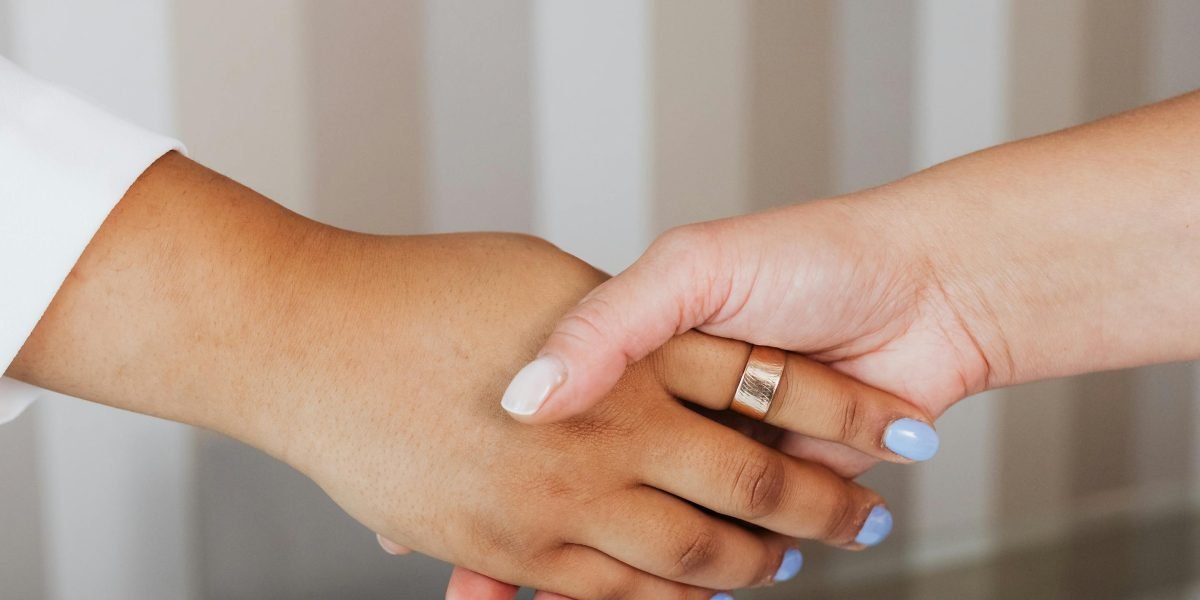 A professional handshake, symbolizing trust and a successful agreement with a reputable real estate broker.